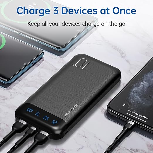 a brushed charcoal power bank connected to three different smartphones at once